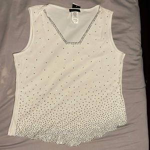 This is a S. Levine sleeveless off-white, rhinestone and pearls on front